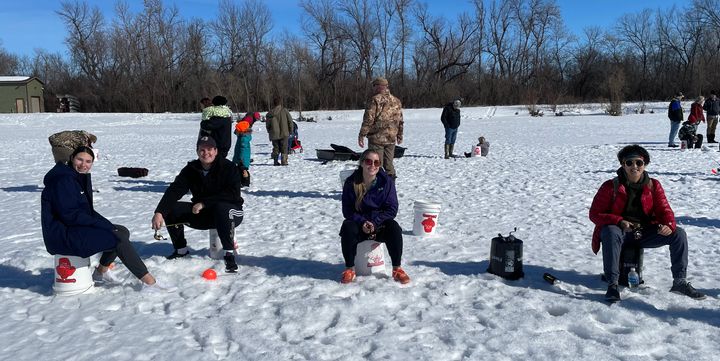 Students learn how to ice fish at Outdoor Campus event